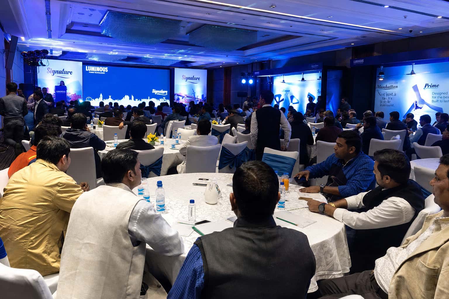 Audience sweep across a pavilion floor